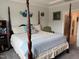 Elegant main bedroom featuring a four-poster bed, soft bedding, and calming decor at 101 Maroon Ct, Raleigh, NC 27610