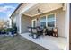 Covered patio with a dining set, perfect for outdoor entertaining at 101 Maroon Ct, Raleigh, NC 27610