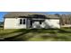 New home backyard with lawn and concrete porch at 102 Heatherglenn Cir, Princeton, NC 27569