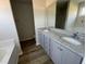 Modern bathroom featuring double sinks and granite countertops at 102 Heatherglenn Cir, Princeton, NC 27569
