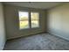 Inviting carpeted room with double window offering natural light at 102 Heatherglenn Cir, Princeton, NC 27569