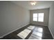 Cozy bedroom featuring natural light from a window and durable laminate flooring at 110 Manor Stone Dr, Clayton, NC 27527