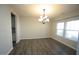 Dining area with hardwood floors, a chandelier, and natural light from windows at 110 Manor Stone Dr, Clayton, NC 27527