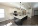 Stylish kitchen with a center island, granite countertops, and white cabinetry at 110 Manor Stone Dr, Clayton, NC 27527