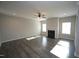 Spacious living room with hardwood floors, a ceiling fan, a fireplace and plenty of natural light at 110 Manor Stone Dr, Clayton, NC 27527