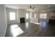 Open living room with a fireplace, hardwood floors, and natural light at 110 Manor Stone Dr, Clayton, NC 27527