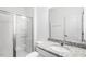 Bathroom features a granite countertop, a single vanity, and a glass enclosed shower at 1129 Sun Springs Rd, Wake Forest, NC 27587