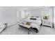 A well decorated bedroom featuring a large bed, two windows, and contemporary furnishings at 1129 Sun Springs Rd, Wake Forest, NC 27587
