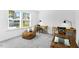 Well-lit bedroom featuring two desks, comfortable seating and a large window at 1129 Sun Springs Rd, Wake Forest, NC 27587
