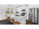 Modern kitchen featuring stainless steel appliances, granite countertops, and a large island at 1129 Sun Springs Rd, Wake Forest, NC 27587