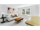 Cozy living room with contemporary decor and natural light from two large windows at 1129 Sun Springs Rd, Wake Forest, NC 27587