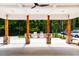 Outdoor kitchen and lounge area with seating and a large concrete entertaining space at 1129 Sun Springs Rd, Wake Forest, NC 27587