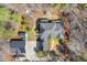 Bird's eye view showing the home's layout, outdoor fireplace, and surrounding landscape at 113 Valley Ln, Pittsboro, NC 27312