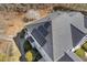 Aerial view of roof showing solar panels installed and partial view of neighborhood at 113 Valley Ln, Pittsboro, NC 27312