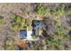 Overhead view of the home and detached garage featuring solar panels and outdoor fireplace at 113 Valley Ln, Pittsboro, NC 27312