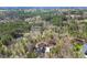 This stunning aerial view captures the home nestled within a lush green forest at 113 Valley Ln, Pittsboro, NC 27312