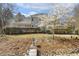 Expansive backyard features lush lawn, mature landscaping and charming water feature for peaceful outdoor living at 113 Valley Ln, Pittsboro, NC 27312