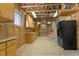 Basement with cabinetry, utility connections, and exposed ceiling providing space for customization at 113 Valley Ln, Pittsboro, NC 27312
