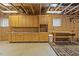 Partially finished basement includes cabinetry, workspace, and durable flooring for versatile use at 113 Valley Ln, Pittsboro, NC 27312