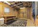 Partially finished basement with exposed ceiling, storage, work bench and versatile flooring at 113 Valley Ln, Pittsboro, NC 27312