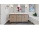 Modern bathroom featuring a double vanity, soaking tub, and stylish fixtures at 113 Valley Ln, Pittsboro, NC 27312