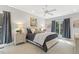 Serene bedroom featuring a plush bed, soft lighting, and views of the outdoors at 113 Valley Ln, Pittsboro, NC 27312