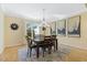 Charming dining room with a modern chandelier, neutral walls, and ample natural light at 113 Valley Ln, Pittsboro, NC 27312