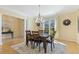 Elegant dining room with a chandelier, large window, and access to other rooms at 113 Valley Ln, Pittsboro, NC 27312