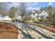Charming two-story home with landscaped yard, and a long driveway, set back from the street at 113 Valley Ln, Pittsboro, NC 27312