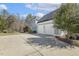 Attached two-car garage with solar panels installed on the roof at 113 Valley Ln, Pittsboro, NC 27312