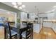 Bright kitchen with hardwood floors, an island, and stainless steel appliances at 113 Valley Ln, Pittsboro, NC 27312