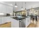 An open kitchen featuring white cabinetry, granite countertops, and stainless steel appliances at 113 Valley Ln, Pittsboro, NC 27312