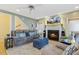 Comfortable living room with a fireplace, plush seating, and large TV for entertainment at 113 Valley Ln, Pittsboro, NC 27312