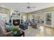 Cozy living room featuring a fireplace, comfortable seating, and access to an outdoor area at 113 Valley Ln, Pittsboro, NC 27312
