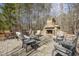 Outdoor seating with an exterior stone fireplace, perfect for entertaining at 113 Valley Ln, Pittsboro, NC 27312