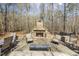Seating area with stone fireplace, and beautiful outdoor wooded setting at 113 Valley Ln, Pittsboro, NC 27312