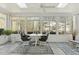 Bright sunroom filled with natural light, featuring seating and views of the outdoors at 113 Valley Ln, Pittsboro, NC 27312