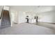 Open concept living space with carpeted floors adjacent to the kitchen at 1140 Centerview Drive, Nashville, NC 27856