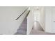 Staircase with carpeted steps and a dark railing leading to the upper level of the house at 1140 Centerview Drive, Nashville, NC 27856