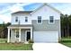 Charming two-story home featuring a two-car garage and a well-manicured lawn in a suburban neighborhood at 1148 Centerview Drive, Nashville, NC 27856