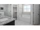 The bathroom features a double vanity, soaking tub and a stand up shower at 115 S Harper Faith Way, Benson, NC 27504