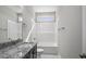 Bathroom features a granite vanity, neutral walls, and a tub and shower at 115 S Harper Faith Way, Benson, NC 27504