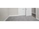 A bedroom features neutral carpet and paint and is accented with white baseboards and doors at 115 S Harper Faith Way, Benson, NC 27504