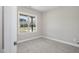 Bedroom with carpeted floor and view of houses out the window at 115 S Harper Faith Way, Benson, NC 27504