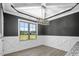 Dining room features large window and black accent wall and geometric trim at 115 S Harper Faith Way, Benson, NC 27504