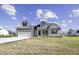 Charming home featuring stone accents, a two-car garage, and a well-manicured lawn at 115 S Harper Faith Way, Benson, NC 27504