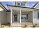 Inviting home entrance with classic columns and a brick-lined walkway at 115 S Harper Faith Way, Benson, NC 27504
