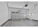A spacious garage features an automatic overhead door and pedestrian door at 115 S Harper Faith Way, Benson, NC 27504