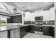 Updated kitchen with stainless steel dishwasher and granite countertops at 115 S Harper Faith Way, Benson, NC 27504