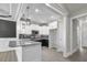 Kitchen with stainless steel appliances, white cabinets, and granite countertops at 115 S Harper Faith Way, Benson, NC 27504